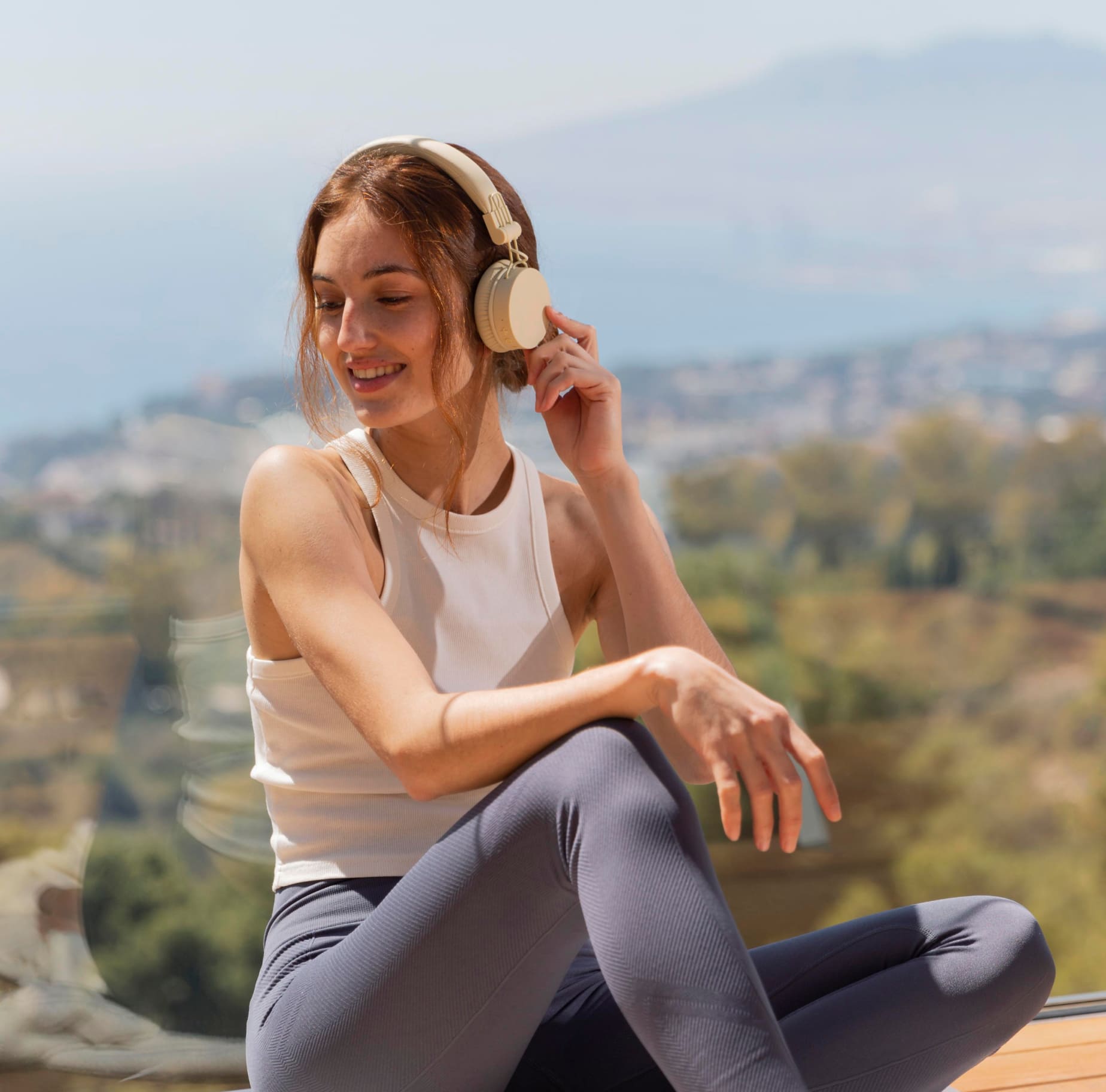 A woman with headphones listening to music